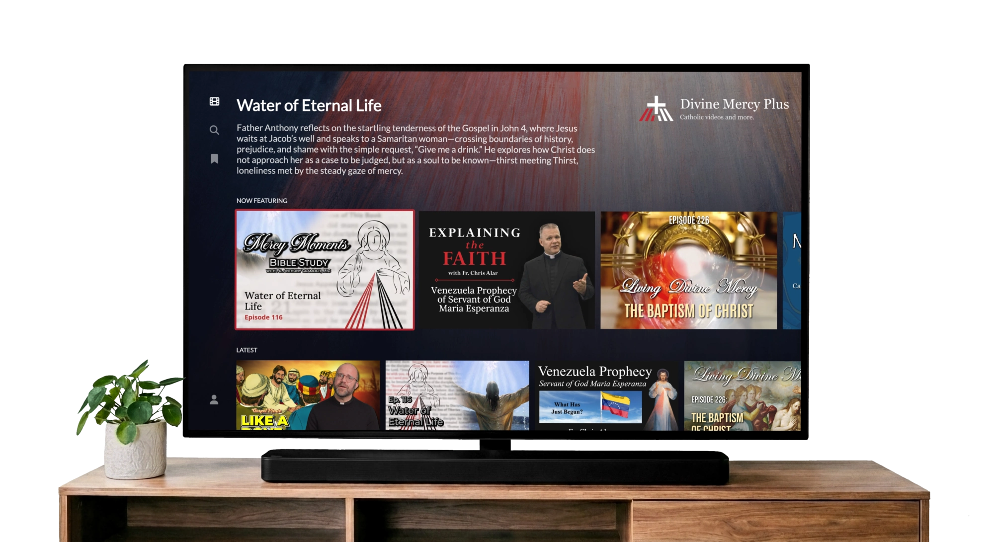 A television displaying the Divine Mercy Plus app.